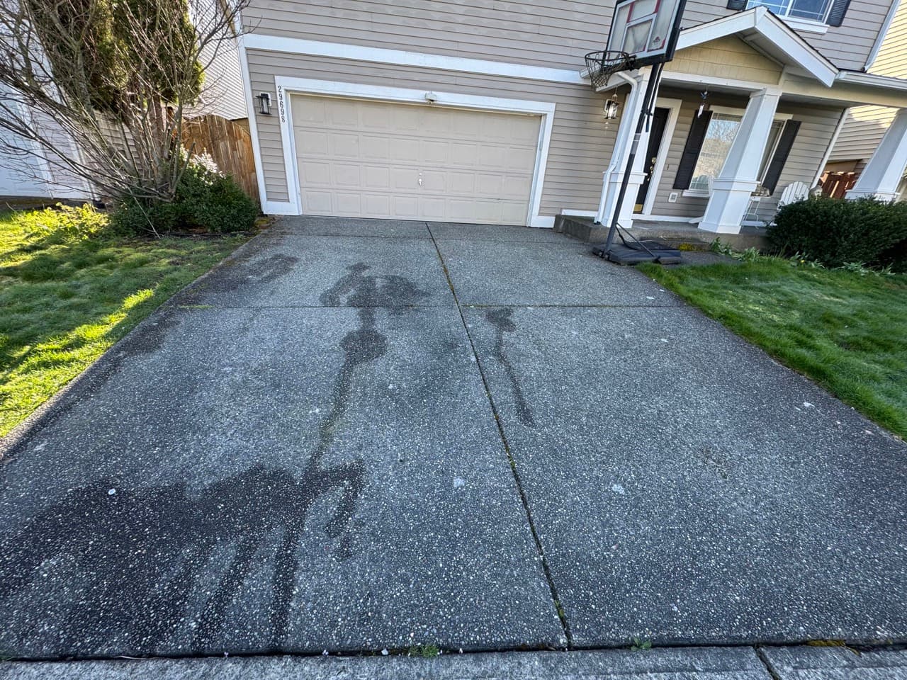 Heavy stained driveway — before