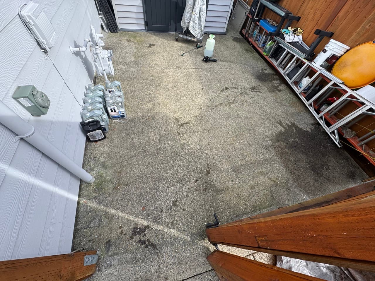 Oil stain on concrete before treatment